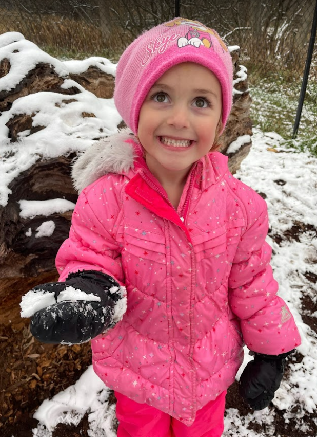 kid holding snow