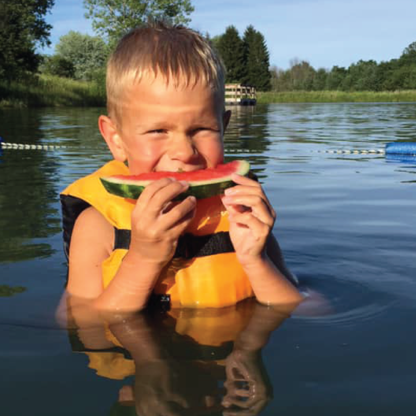 Photo of boy eating watermelon